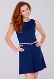 Cute young woman in navy blue dress on white