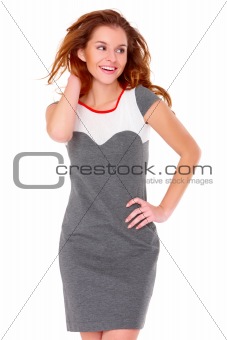 Cute young woman in gray dress on white