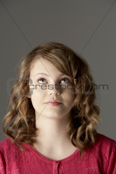 Studio Portrait Of Teenage Girl Looking Up