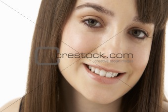 Studio Portrait Of Teenage Girl On White Background