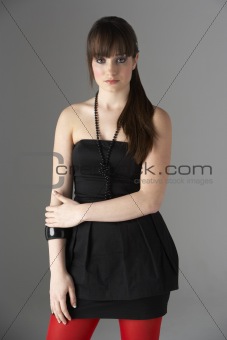 Studio Portrait Of Fashionably Dressed Teenage Girl