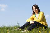 Teenage Girl Sitting In Summer Meadow