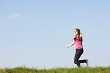 Teenage Girl Running Through Summer Meadow