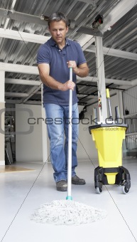 Cleaner mopping office floor