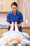 Osteopath treating female client