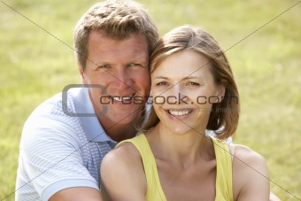 Middle aged couple having fun in countryside