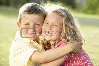 2 Children hugging outdoors