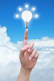 light bulb in women hand on sky