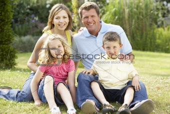 Family relaxing in countryside