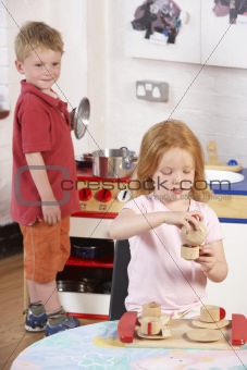 Two Young Children Playing Together at Montessori/Pre-School
