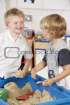 Two Young Children Playing Together at Montessori/Pre-School