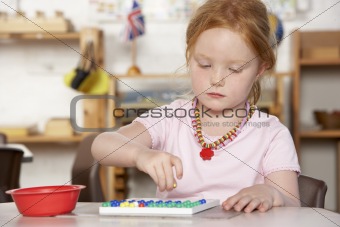 Young Boy Playing at Montessori/Pre-School