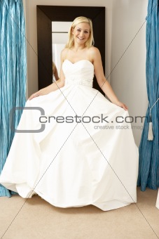 Bride trying on wedding dress
