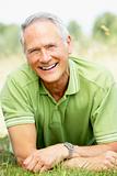 Portrait of mature man relaxing in countryside