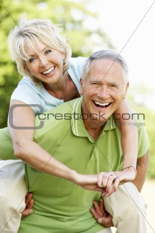 Mature couple having fun in countryside