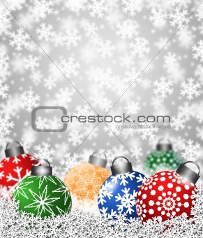 Colorful Snowflake Ornaments on Snow