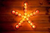 christmas candles pentagram star on wood
