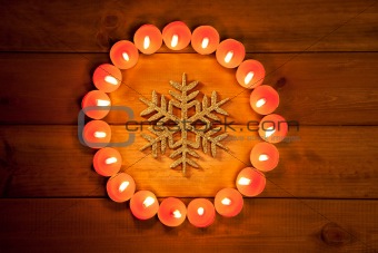 christmas candles circle over wood and symbol