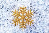 chritmas golden snowflake symbol on ice