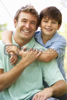 Portrait Of Father And Son In Park