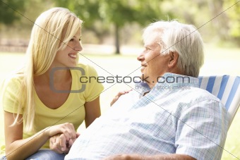 Senior Man Talking To Adult Daughter