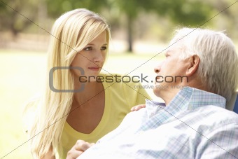 Senior Man Talking To Concerned Adult Daughter