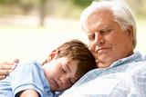 Grandfather And Grandson Taking Nap Together