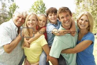 Mother And Father Giving Children Piggy Back With Grandparents