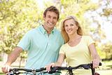 Young Couple On Cycle Ride in Park