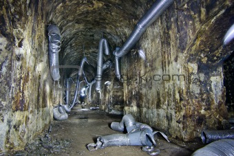 Aborted ventilation pipes in an underground room.