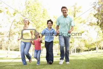 Family Running In Park