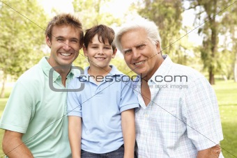 Grandfather With Father And Son In Park