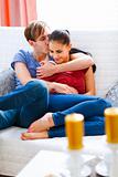 Cheerful couple in love enjoying themselves at home

