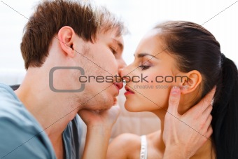 Romantic young couple having kiss
