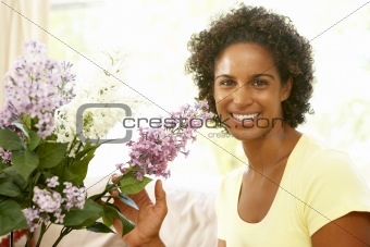 Woman Flower Arranging At Home
