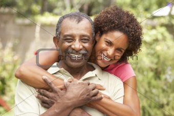 Senior Man Hugging Adult Daughter