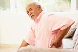 Senior Man Suffering From Back Pain At Home