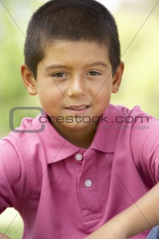 Portrait Of Young Boy In Park