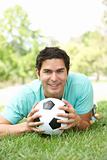 Portrait Of Young Man In Park With Football