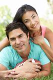 Couple In Park With American Football