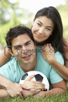 Couple In Park With Football