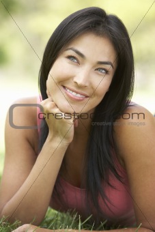 Portrait Of Young Woman In Park