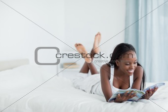 Young woman reading a magazine