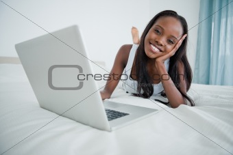 Woman watching a movie on her laptop