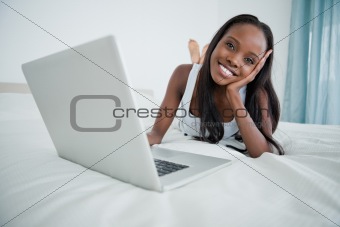 Woman watching a movie on her notebook