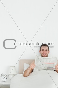 Portrait of a man reading a newspaper