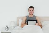 Cute man using a tablet computer