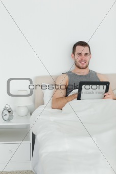Portrait of a handsome man using a tablet computer