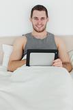 Portrait of a happy man using a tablet computer