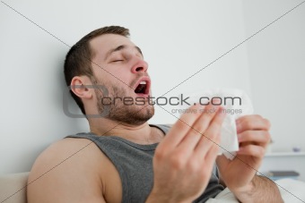 Sick man sneezing